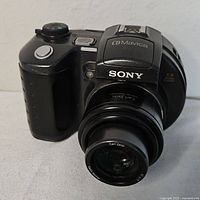 Front view of black Sony CD Mavica camera showing Carl Zeiss Vario-Sonnar lens and branding.