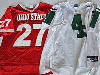 Ohio State red jersey #27 and New York Jets white jersey #4 Brett Favre side by side showing front details