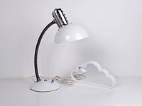 Front view of the white vintage goose neck industrial desk lamp with chrome ventilation and white plastic cloud mirror beside it.