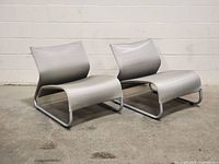 Front three-quarter view of both chairs showing overall design and condition