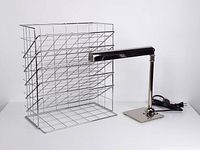 Wide shot of desk lamp and wire magazine holder