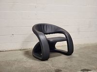 Three-quarter view showing overall sculptural form and upholstery