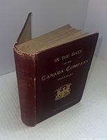 Full view of the book showing spine and cover with title and emblem.