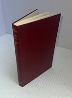 Hardcover book with maroon cover and gold embossed spine text.