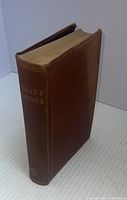 Front angled view of brown hardcover book titled 'Curran's Speeches' with worn top edges.
