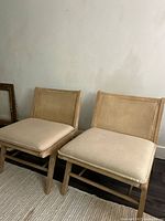 Front view of both cane accent chairs