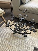 Front view showing entire scrollwork log holder