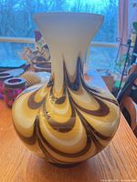 Front view of swirl glass vase showing colors and shape