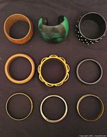 Nine assorted bracelets arranged in three rows