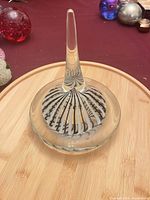 Full view of ring holder showing conical stem and swirl pattern