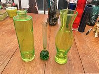 Group shot of three green and yellow bud vases