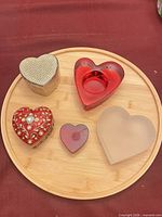 Overview of all five heart-shaped items on wooden tray