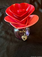 Front view showing heart-shaped cap and charm