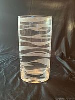 Full view of cylindrical clear glass vase with frosted stripes