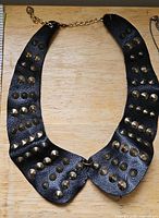 Black faux leather collar necklace with gold-tone studs