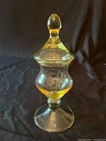 Full view of amber crystal apothecary jar with lid