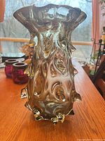 Front view of smoky gray-olive art glass vase with spike accents