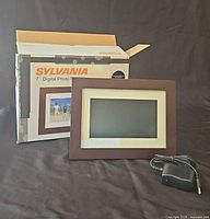 Frame, power adapter, and box front