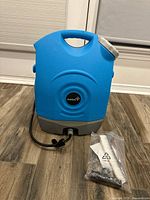 Front view of blue Ivation portable shower unit