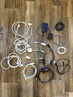 All 14 cables and adapters laid out on floor