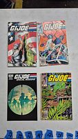 Front view of 4 G.I. Joe comic books laid out showing cover art