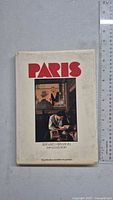 Front cover of PARIS photography book showing title, photo and authors.