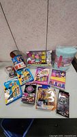 Full overview of toys including Peppa Pig and robot set, collectible cars, Marvel and LEGO figures, kids books and blanket.