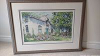 Front view of framed print showing cottage and garden scene