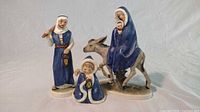 Full view of the set showing Joseph, Mary with baby Jesus on donkey, and angel figurines.