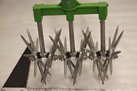 close-up of three detachable star tines and green head