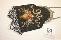 Full view of antique beaded purse showing basket of flowers design, nickel-silver frame and chain