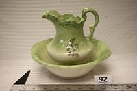 Pitcher nested in basin, showing colour, moulded design and transfer pattern