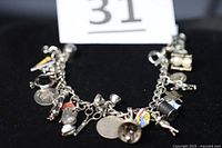 Full view of sterling charm bracelet with assorted charms