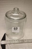 Full view of jar with lid and ruler for scale