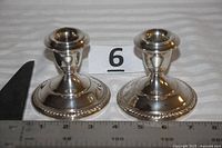 Both candle holders front view with scale reference