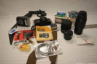 All items laid out: Ricoh XR-1 body, lenses, flash, manuals, filters, cleaning items