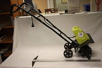 Side view of cultivator showing full length and handle