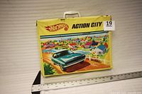 Closed Action City carry-case front graphic