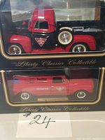 Both boxed die-cast vehicles together in packaging