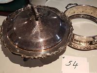 Covered silver plated chafing dish and pierced holder
