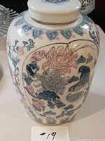 Full view of ginger jar front, lid on