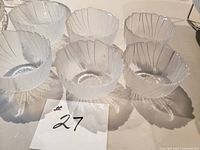 Six matching clear/frosted glass bowls front view