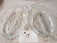 Both clear patterned glass divided relish dishes side by side