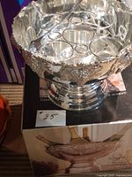 Punch bowl on pedestal with insert and ladle visible