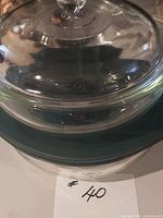 Stacked view showing both clear glass Pyrex casseroles with lids