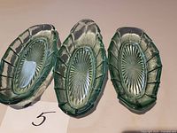 All three green glass boat dishes top view