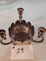 Front view showing lotus bowl, three arms and candle cups