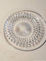 Single plate showing full diamond-cut pattern and starburst centre