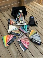 All eight fan decks spread out with carrying case and sleeve visible