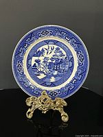 Front view of plate showing full Blue Willow design and border
